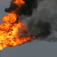 Flames rise in a burn-off of toxic gases at an oil refinery near Los Angeles.